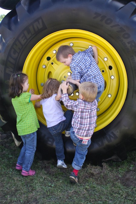 kids on tractor wheel